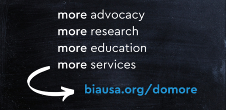 chalkboard with text that says more advocacy more research more education more services. biausa.org slash donate.