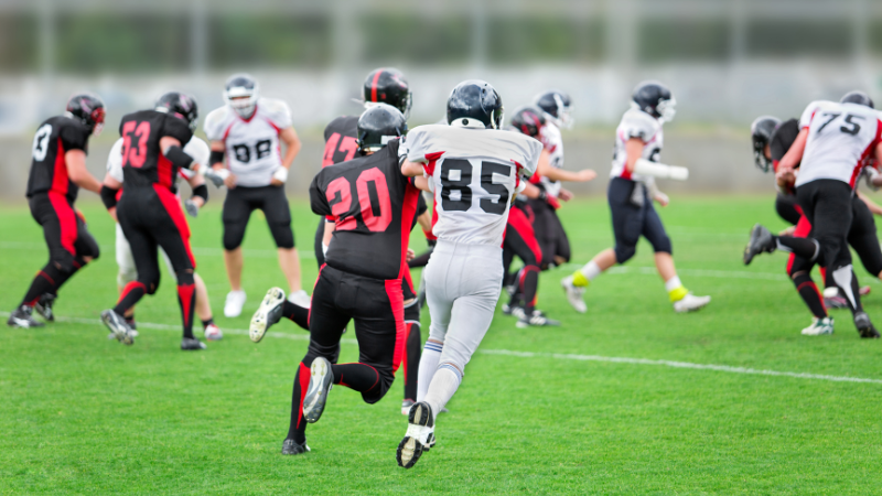 Two football players running