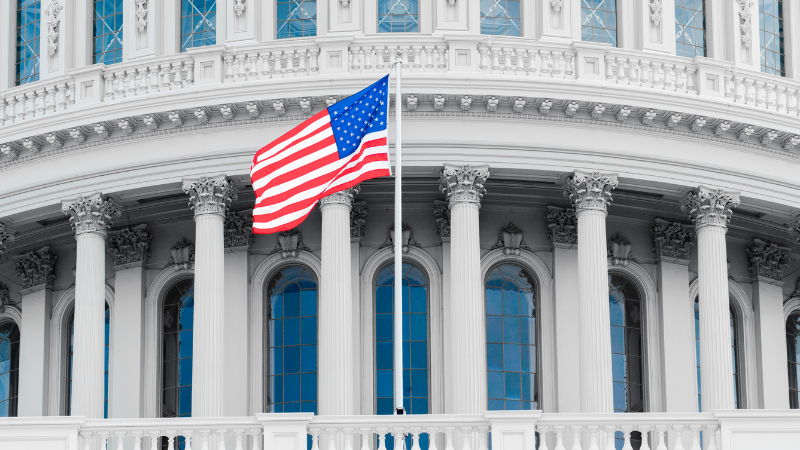 American flag in front of the U.S. Capitol building