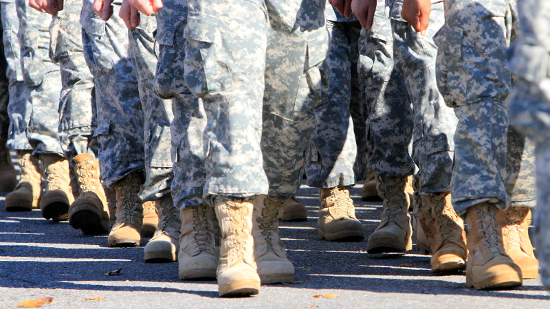 Group of military servicemembers walking.