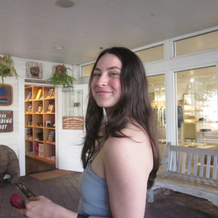 Photo of the author, Sarah Goody, standing indoors