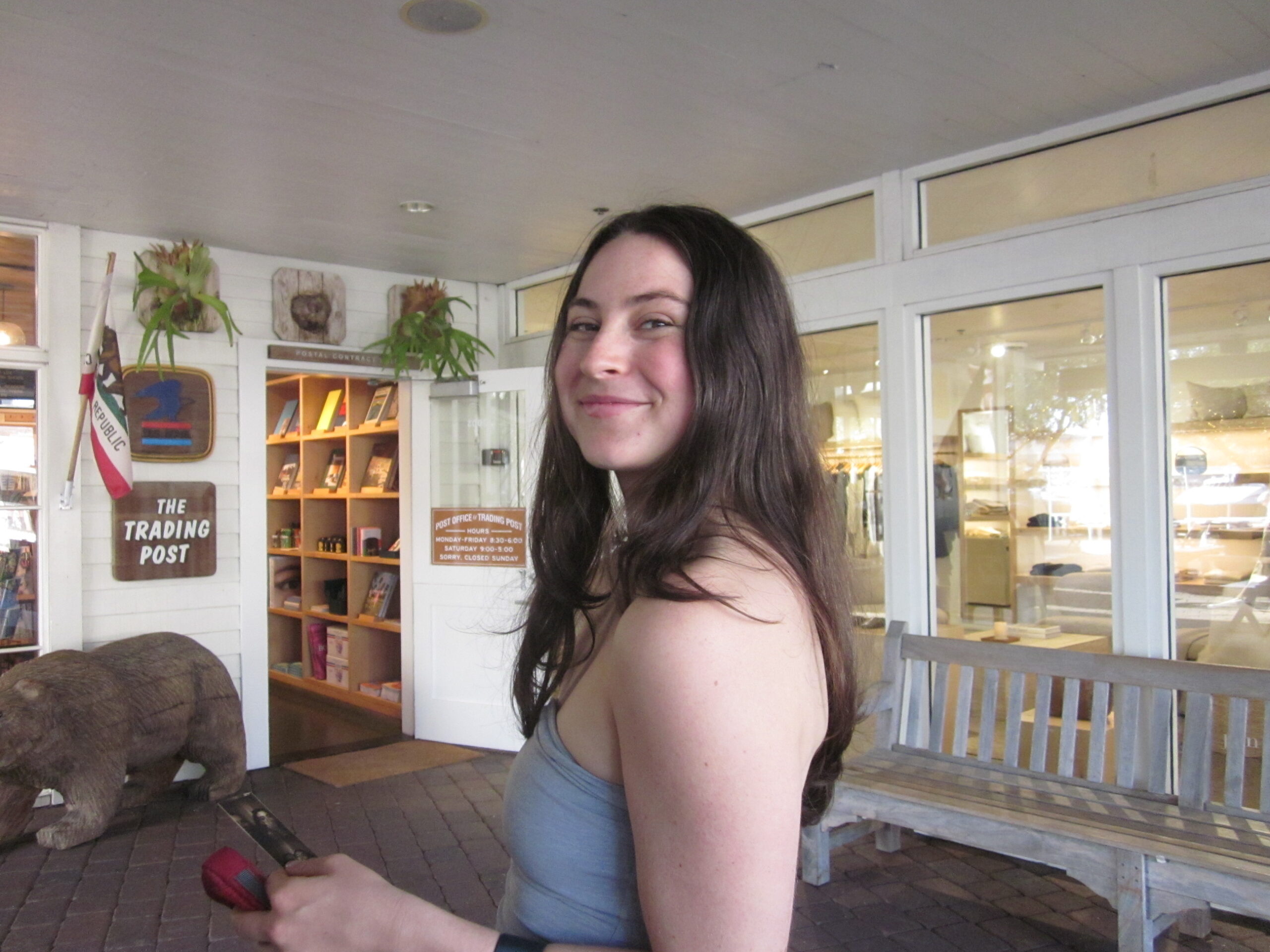 Photo of the author, Sarah Goody, standing indoors