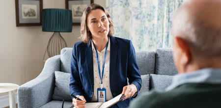 social worker sitting with a patient